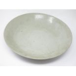 An Oriental Celadon large Saucer Dish, 14 1/2 in, small repair and hair crack