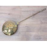 An 18th Century brass Warming Pan with brass handle and pierced design to the cover, 3ft 9in L