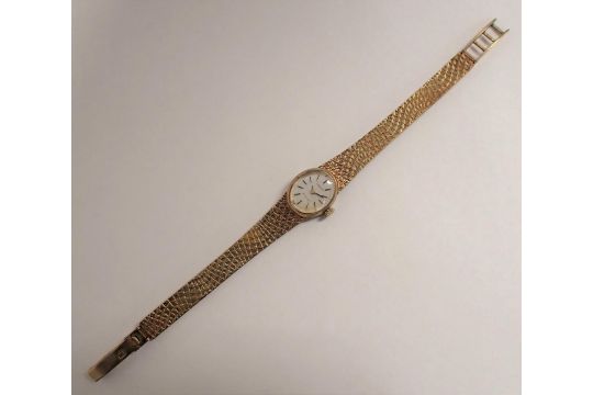 A 1970's lady's Tissot manual Wristwatch, the silvered oval dial with hourly baton markers on