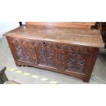 A 17th Century oak Dower Chest with plank lid above arcaded frieze and three floral and leafage