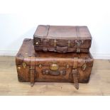 A large heavy leather Travelling Trunk with brass fittings, 3ft W and a leather Suitcase with