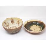 An antique slipware pottery Bowl with green and yellow glaze 9 3/4in D and a pottery Bowl with