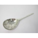 A 17th Century silver Spoon with leafage engraved pear shape bowl, the reverse with initials and
