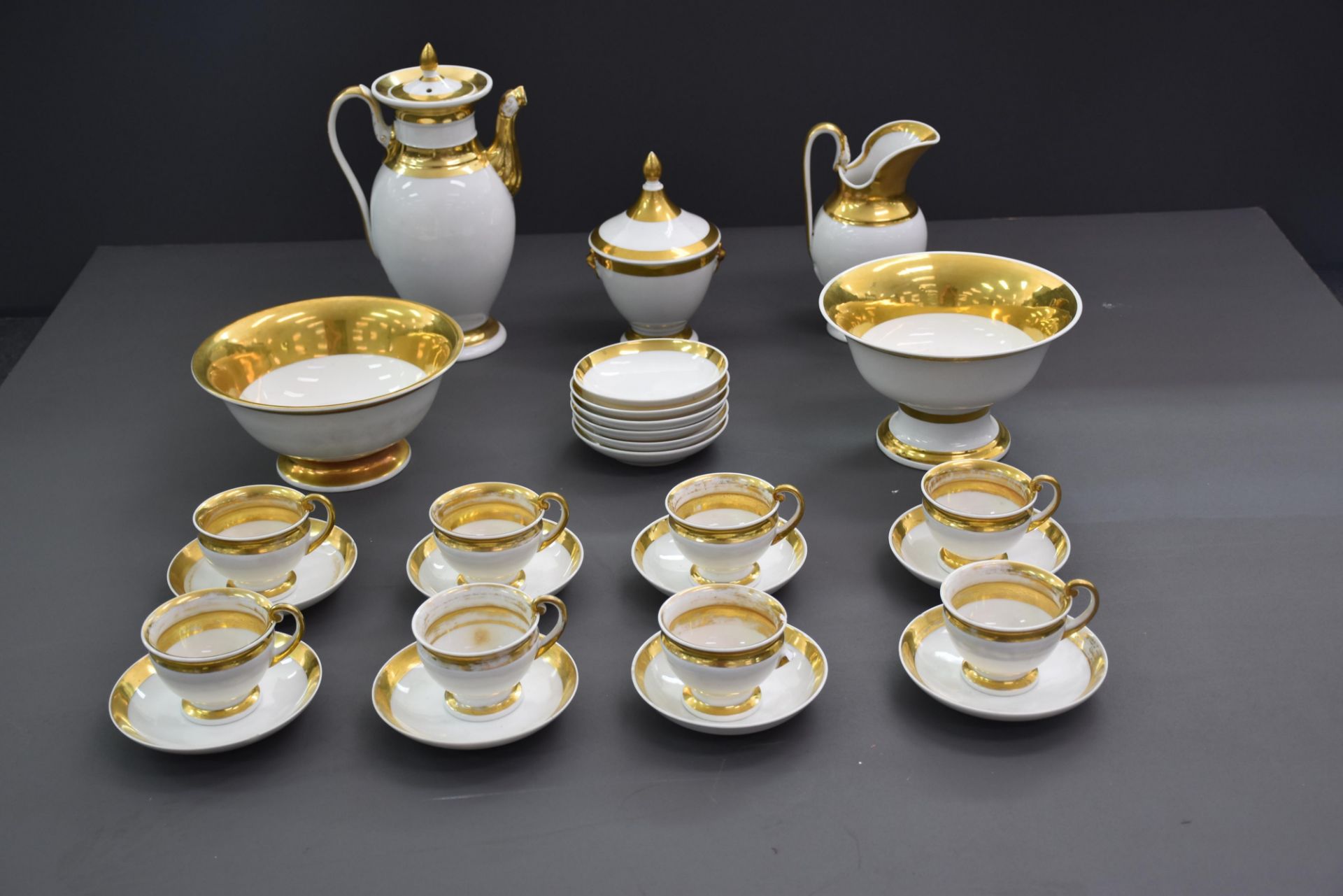 Part of a coffee service in Brussels porcelain with golden edges. Empire style. Composed of a coffee