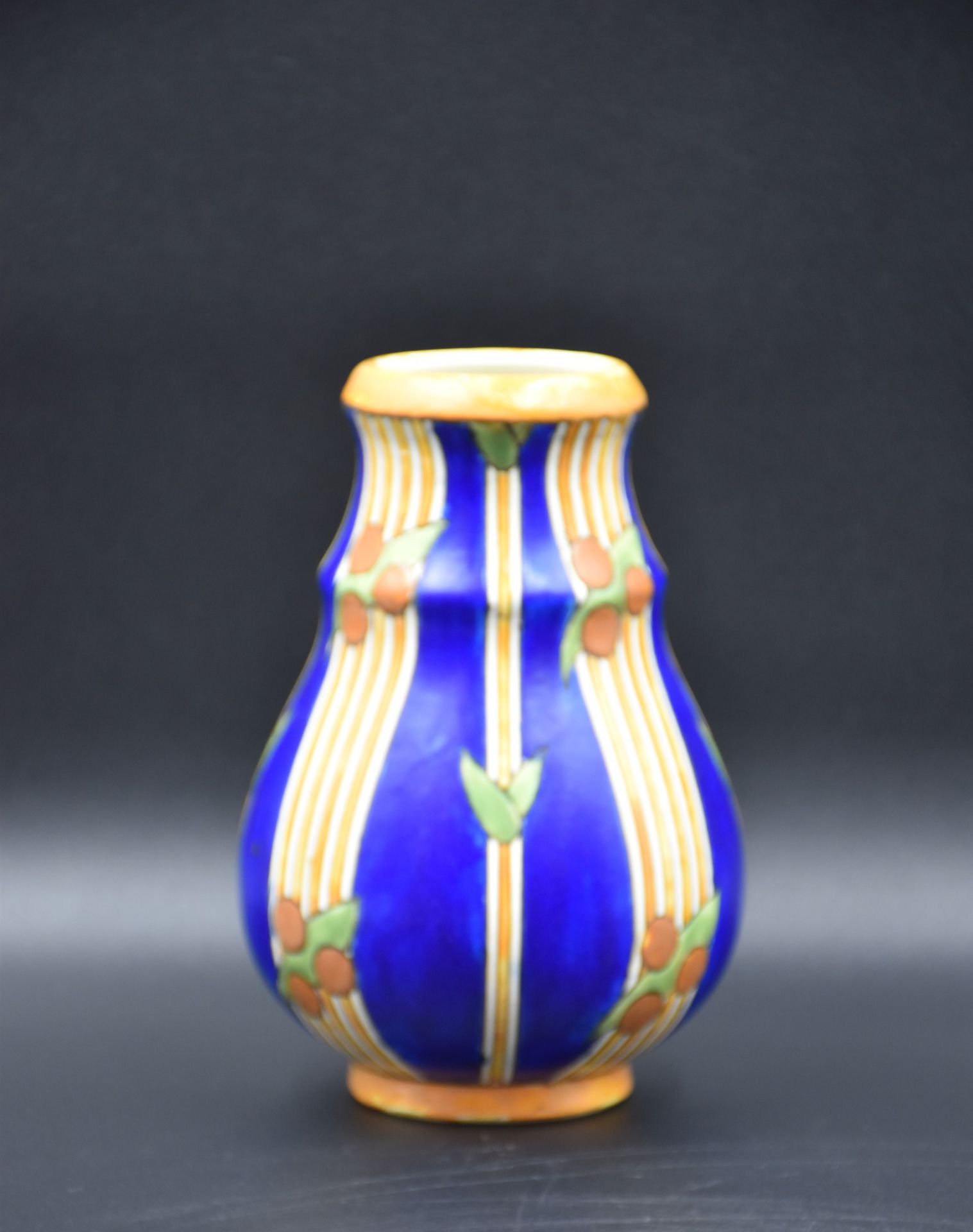 Boch Keramis vase decorated with horizontal bands and stylized laurels. D.786 Ht : 18,5 cm.