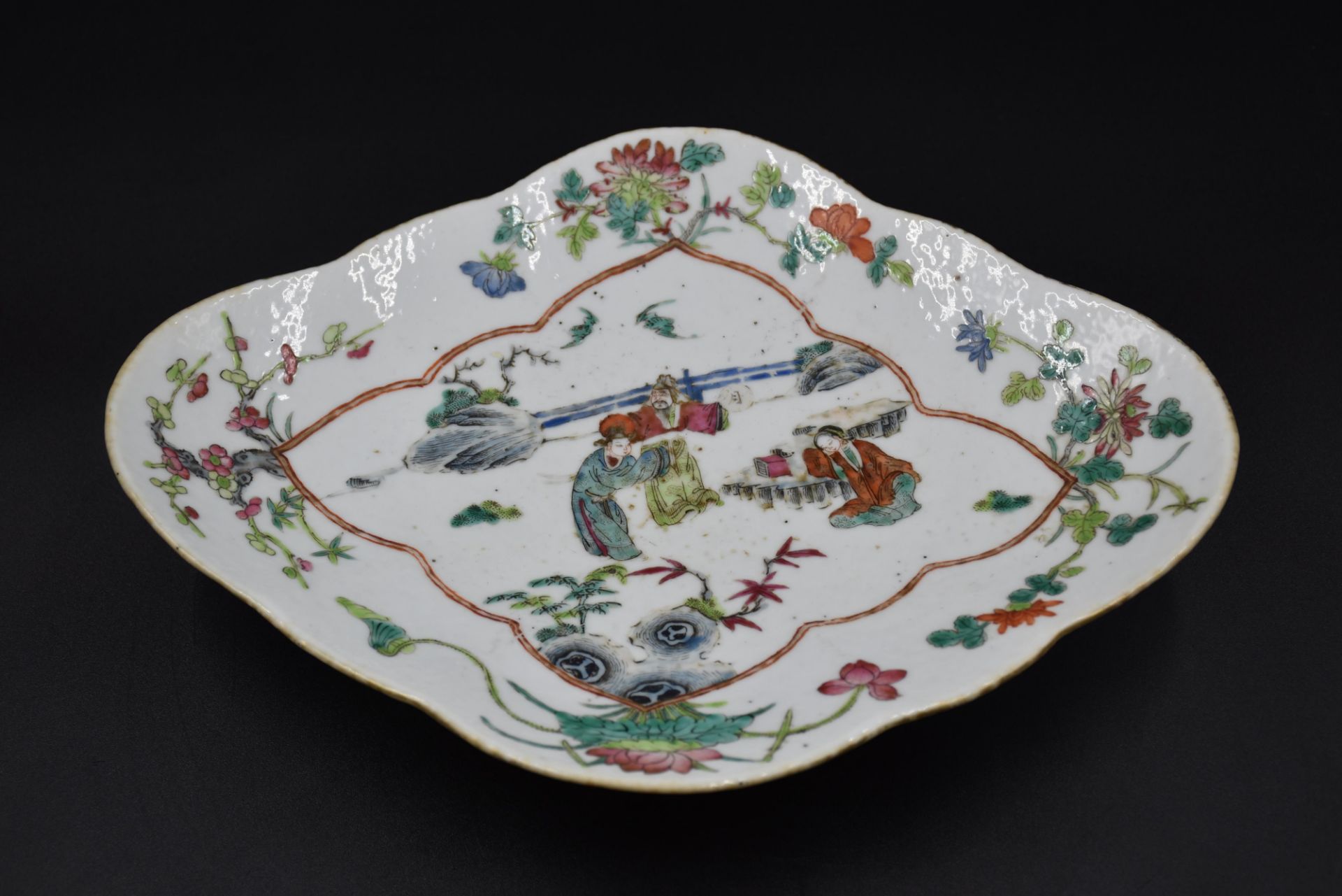 Chinese porcelain ramekin dish with animated decoration.