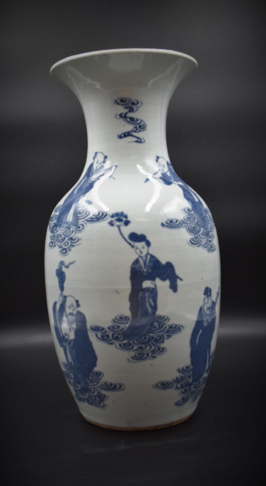 Chinese porcelain vase decorated with immortals and its wooden base ht: 46 cm.