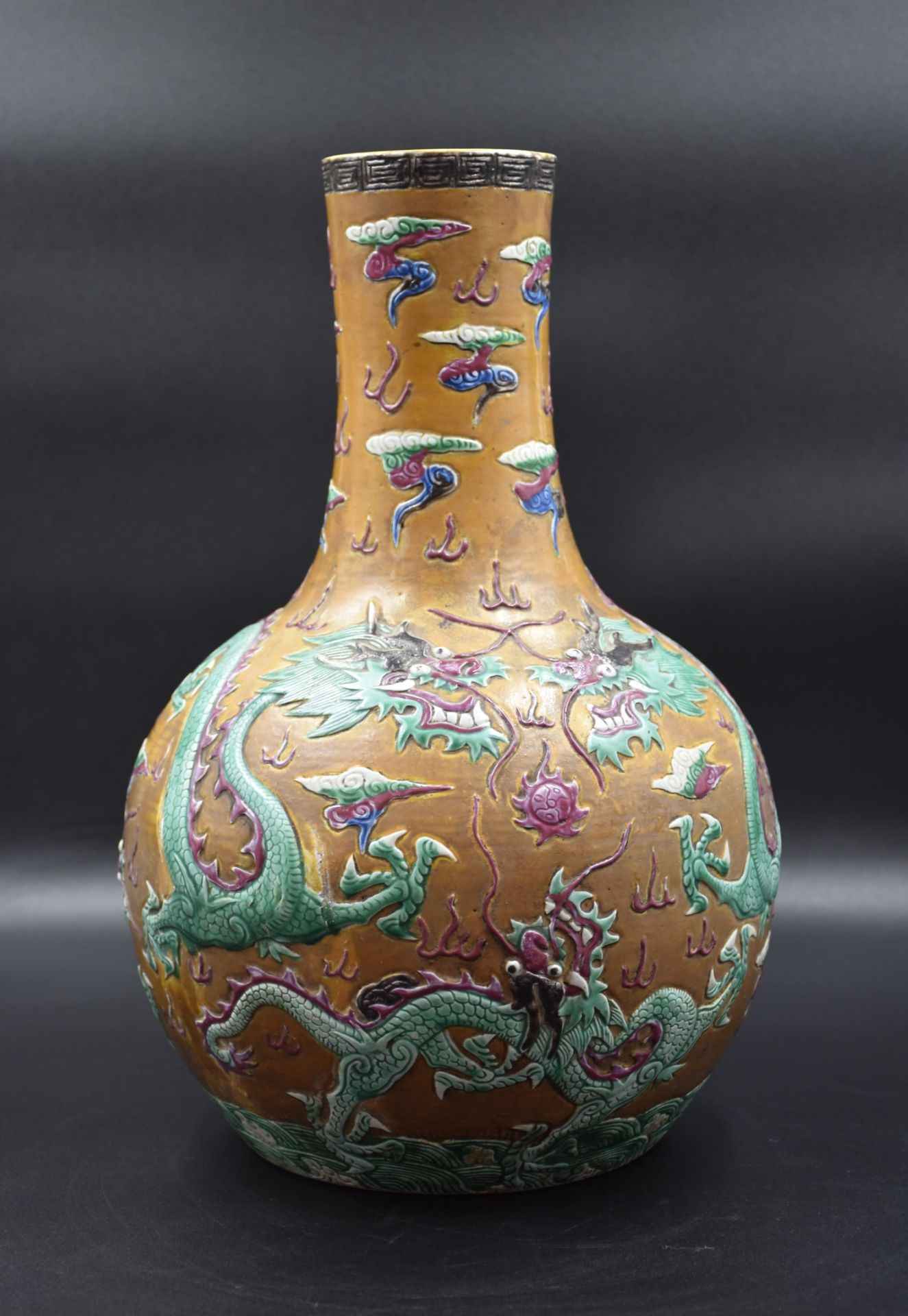Porcelain vase of China XIX ème century with decoration of dragons in relief. (chip in the neck). He