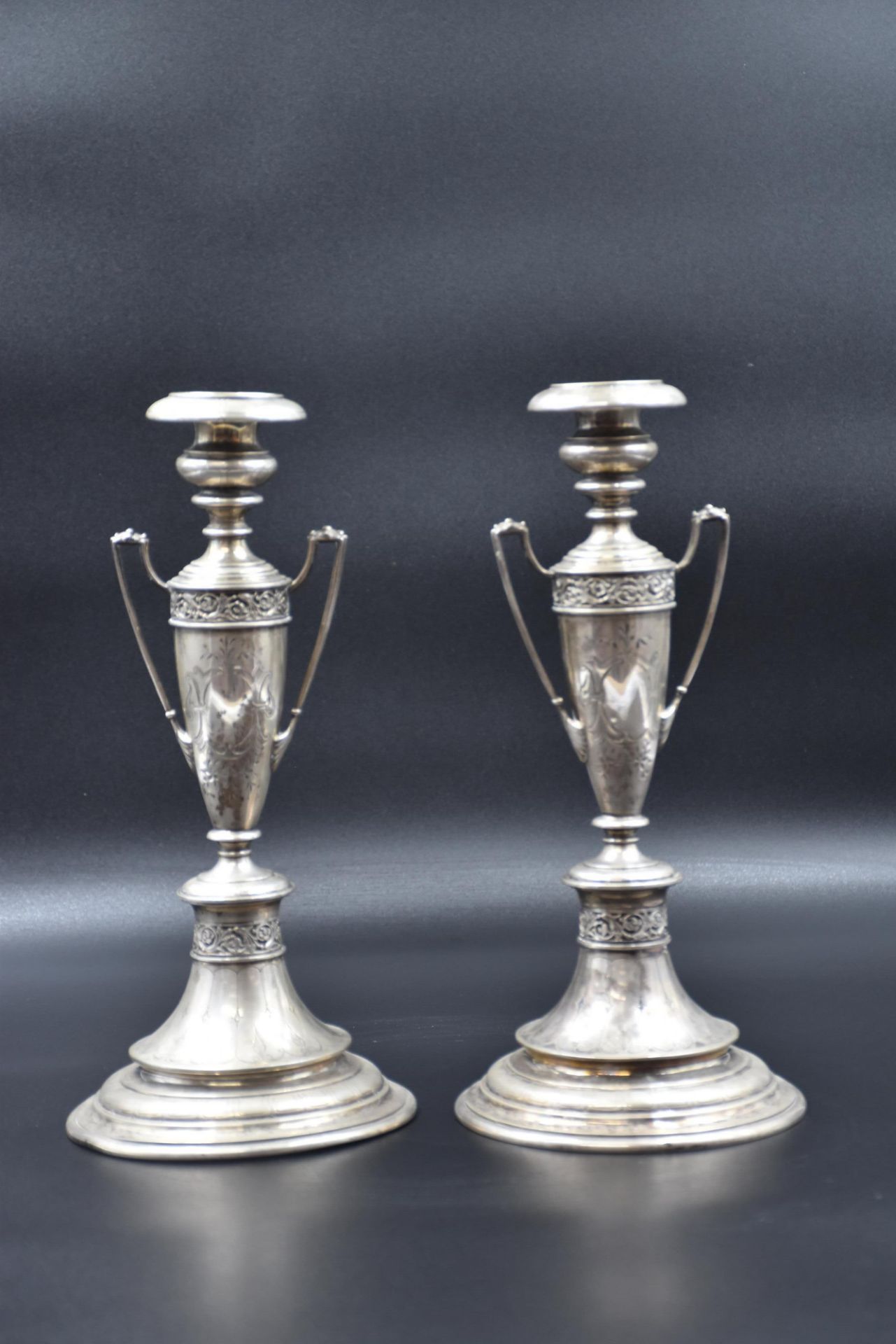 A pair of silver candlesticks. 19th century. Height : 30 cm.