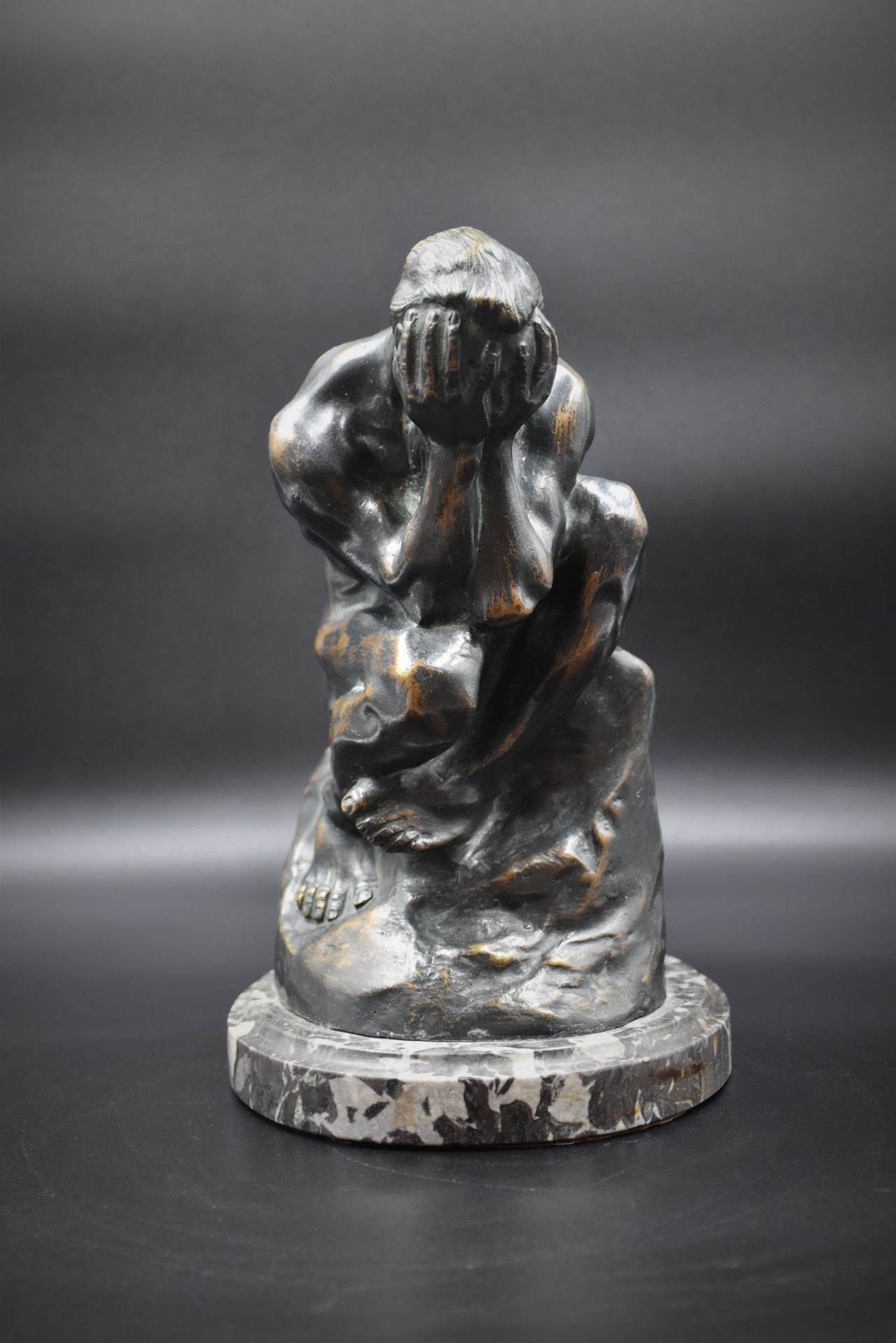 A. RODIN Bronze figure holding his head in his hands. Work around 1930. Bears the signature A. Rodin