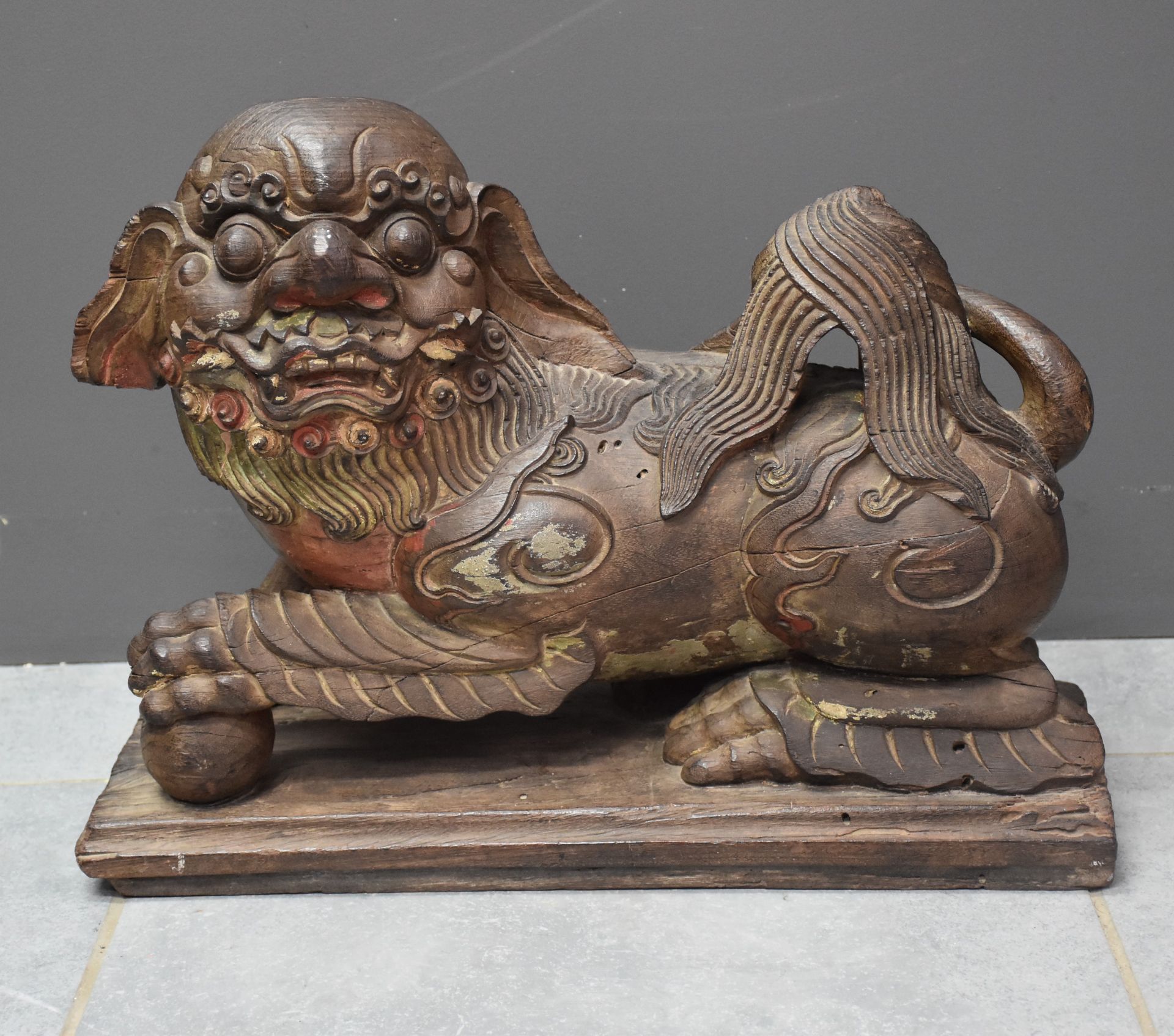 Two carved ironwood dogs, left front paw resting on a sphere, remains of polychromy. China end of 19 - Image 3 of 4