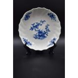 Tournai porcelain dish with twisted ribs. Mark with crossed swords. Diameter : 22,5 cm.