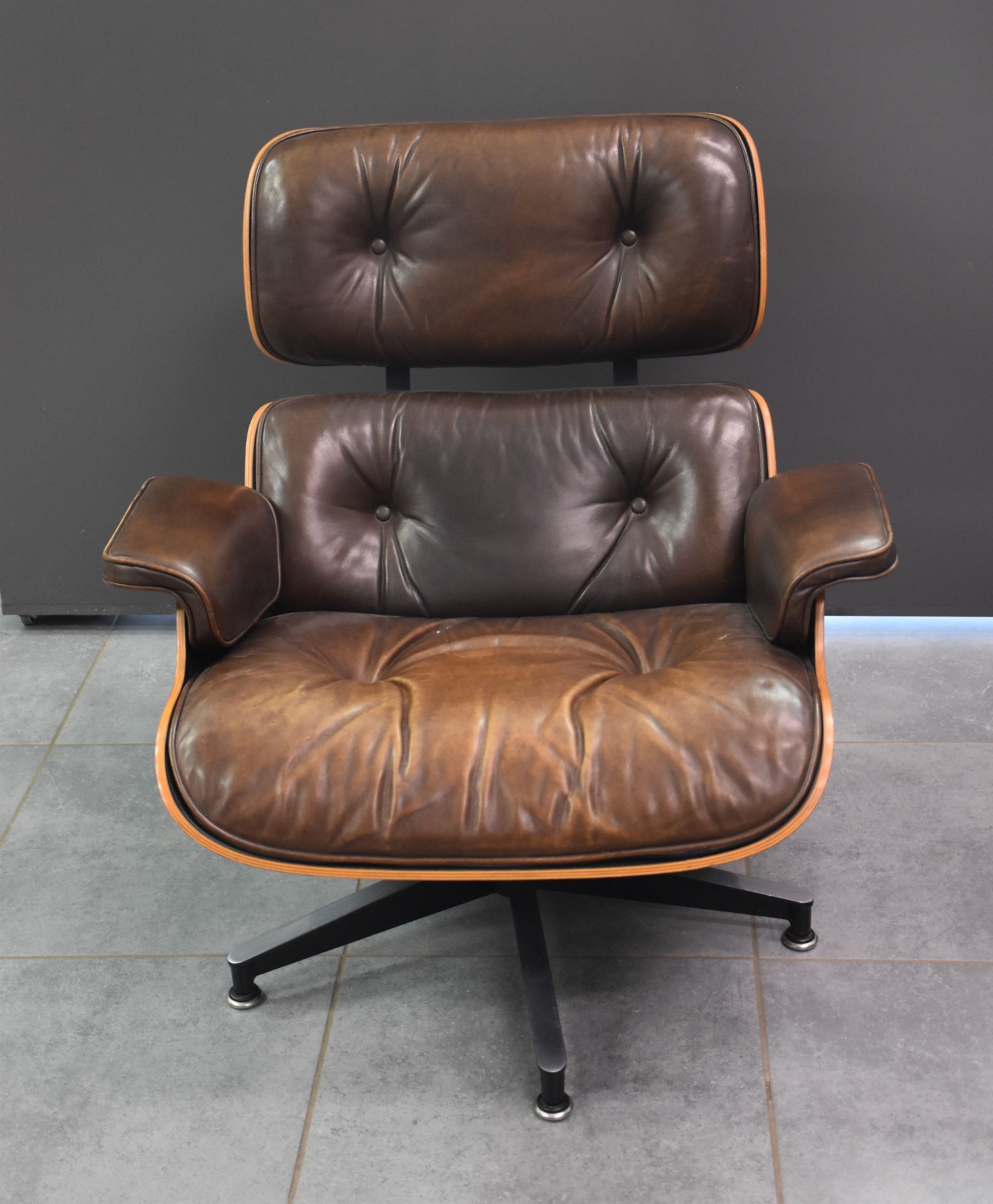 Charles and Ray Eames Vintage armchair. Brown leather.