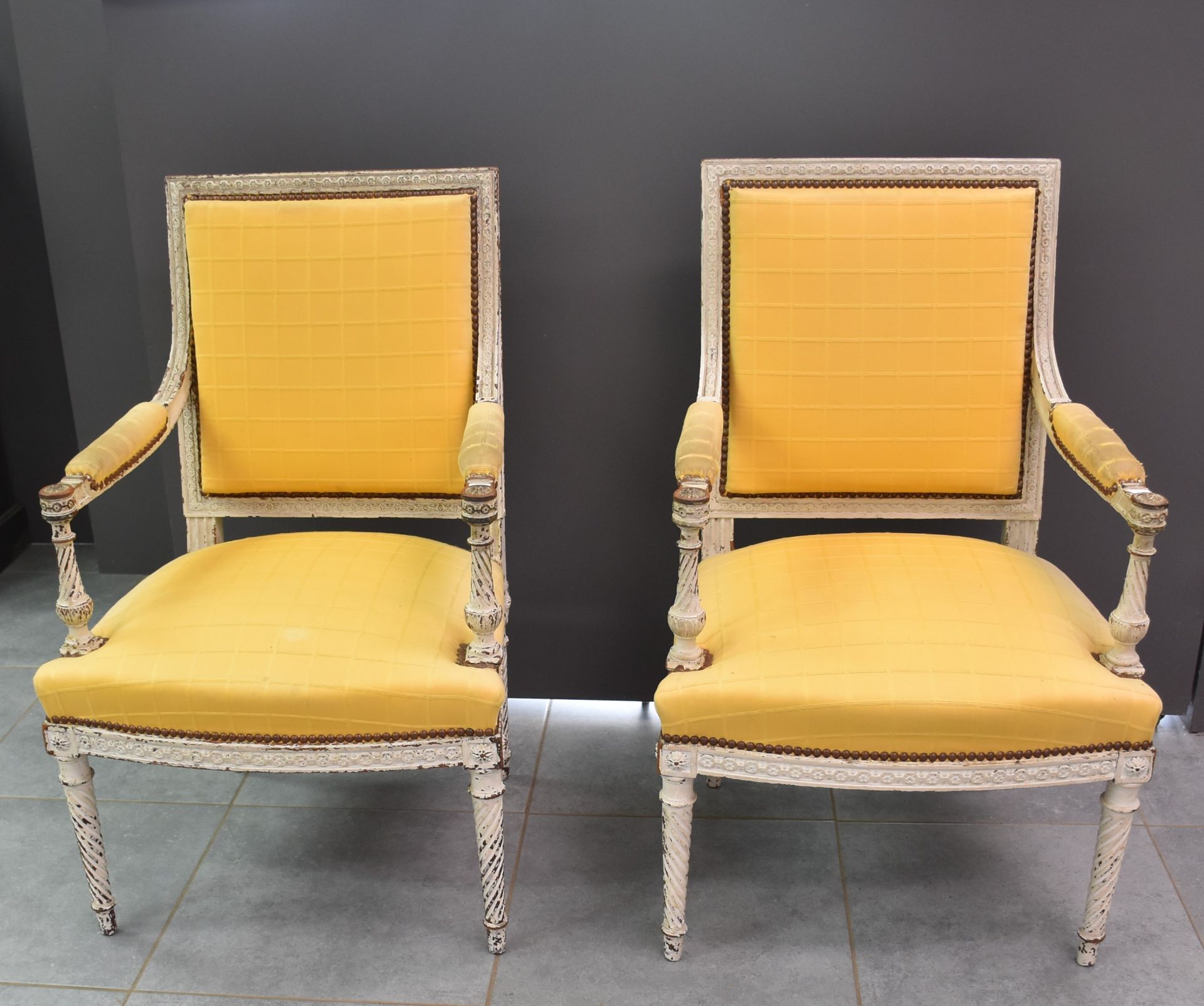 Pair of Louis XVI style armchairs with grey patina.