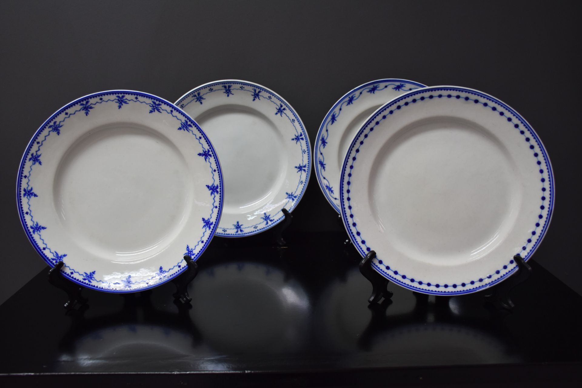 Set of four porcelain plates of Tournai including three decorations with the thought and a