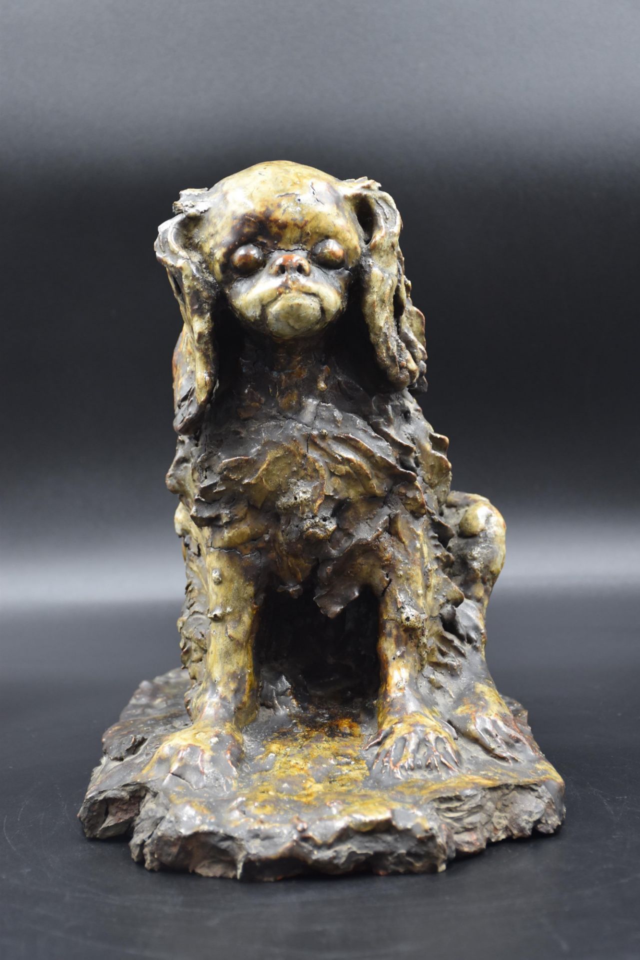 Enamelled stoneware sculpture circa 1940 representing a cocker spaniel. Signed on the terrace on the