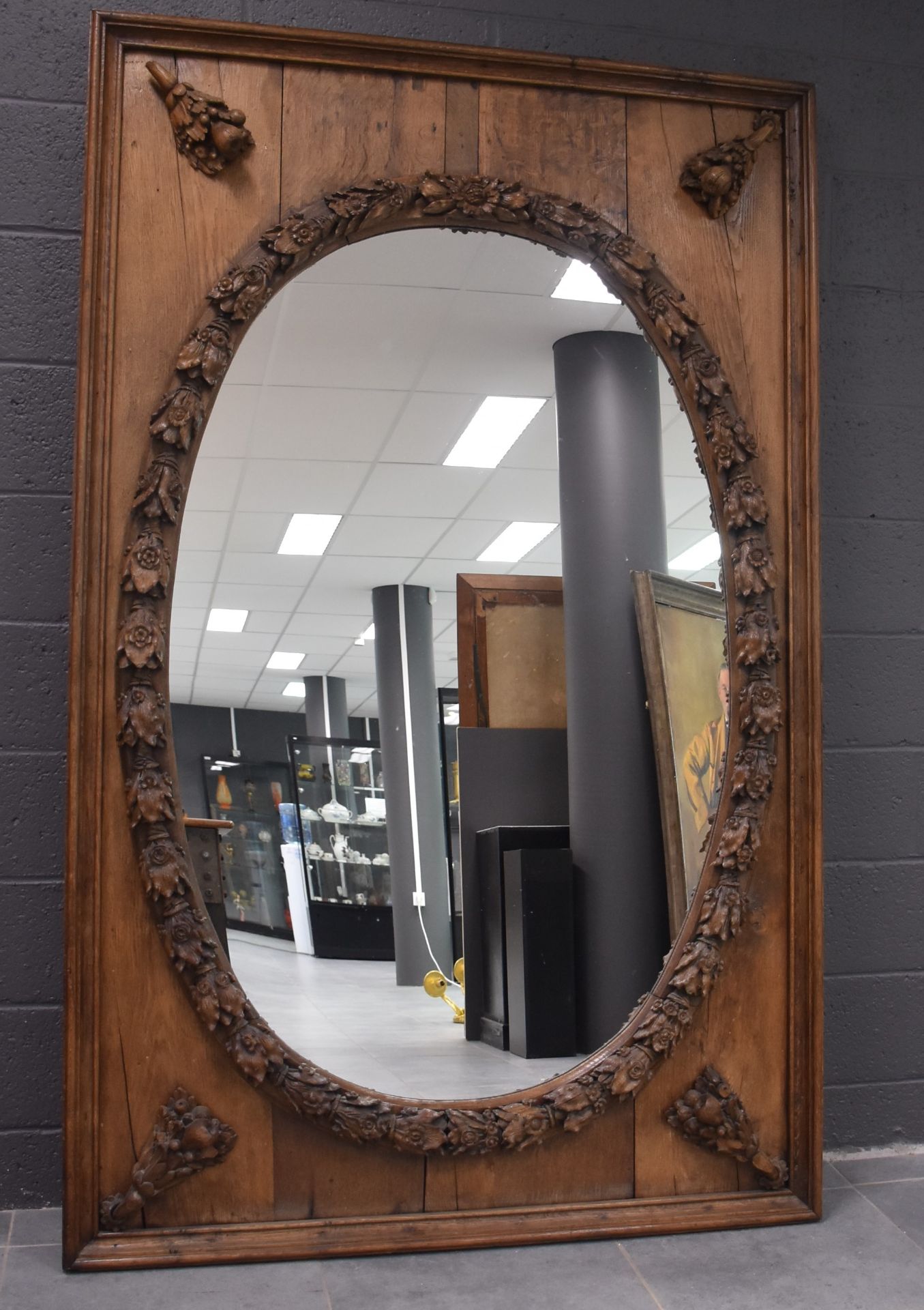 Imposing Italian mirror in carved wood. Missing a small rose window in the upper left corner. Height