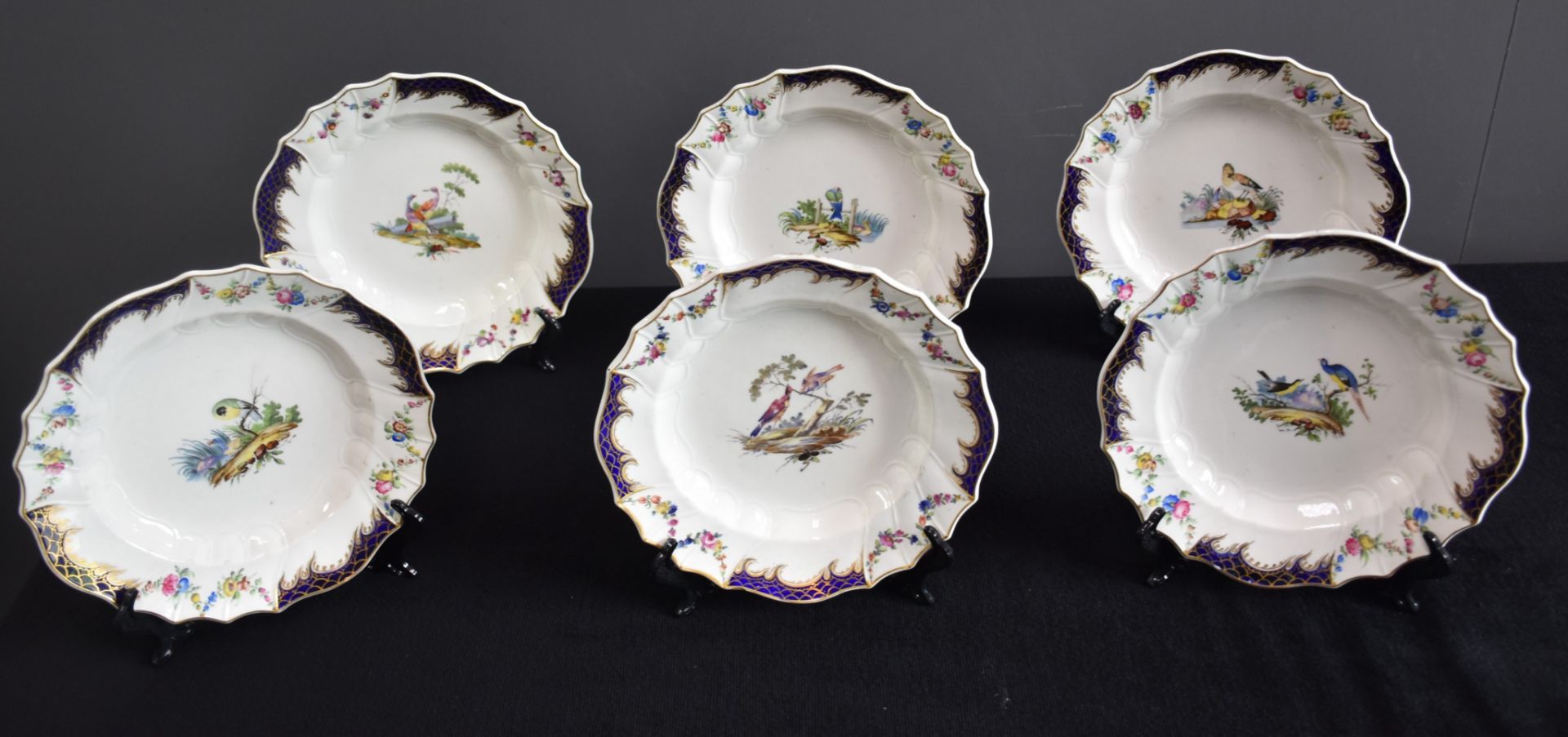 Nice set of six soup plates in polychrome Tournai porcelain decorated with birds of our forests.