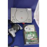 A Sony play station & two games (untested)