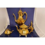 A selection of brass kettles & teapots etc