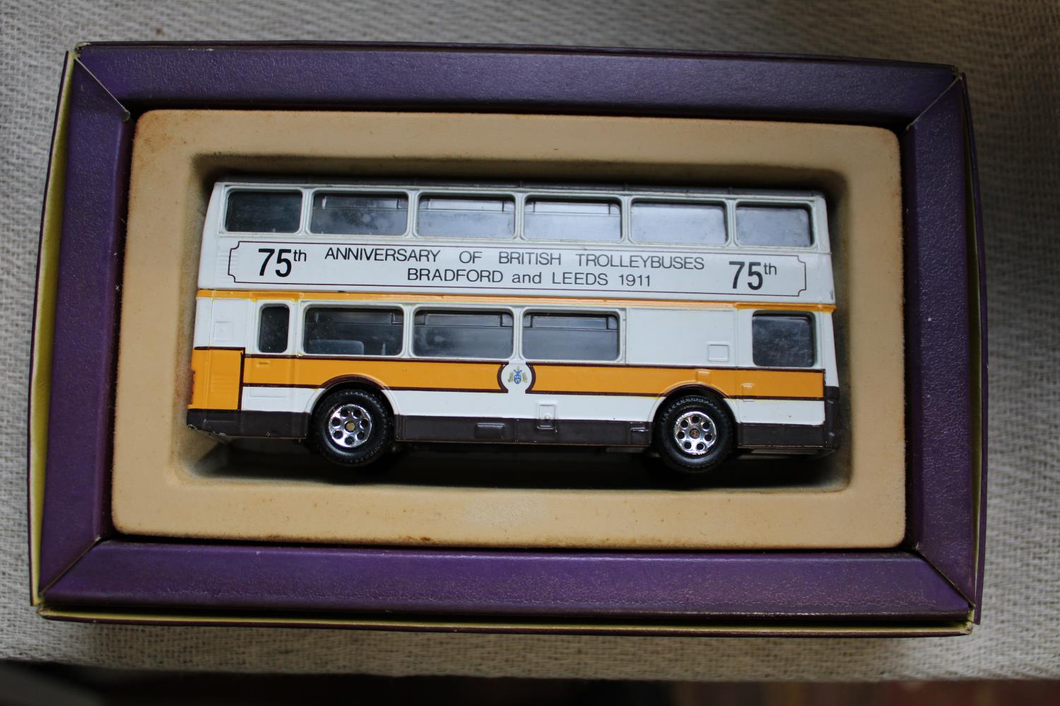 A boxed Corgi die-cast bus model