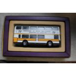 A boxed Corgi die-cast bus model