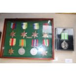 A framed & glazed set of WW2 medals & one other