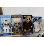 Four boxed as new collectable Meerkat toys