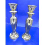 A pair of stylish brass candlesticks 27cm tall
