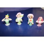 Four collectable ceramic half doll figures