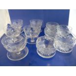 Two sets of cut glass dessert bowls