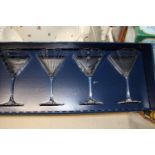 A boxed set of four large cocktail glasses