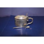A Walker & Hall silver plated mustard pot and spoon with blue liner