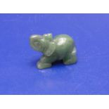 A small carved jade elephant 5cm x 4cm