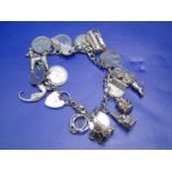 A silver charm bracelet & charms 50gms total