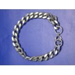 A silver kerb bracelet 31gms total