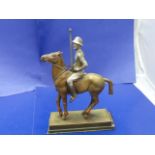 A gilt spelter polo player on plinth 22cm tall