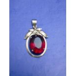 A 14ct gold pendant with large red stone