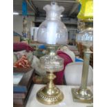 A quality oil lamp with a Hink's rise & fall burner with a cut glass font