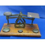 A set of Edwardian postal scales complete with weights