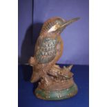 A antique cast iron doorstop in the form of a wood pecker