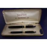 A vintage Sheaffer 'Snorkel' fountain pen & pencil set. Pen has a 14ct gold nib. (etched engraved