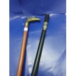 Two vintage walking canes, to include a Indian ebony & ivory sword stick (walking stick part is