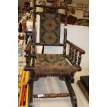 A quality antique child's rocking chair (with original upholstery) 69cm tall