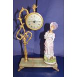 A vintage onyx base ceramic figure & clock