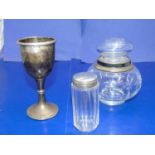 A hallmarked silver trophy, silver collared bottle & one other silver topped bottle (trophy weight