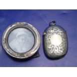 A hallmarked silver small photo frame & white metal vesta case