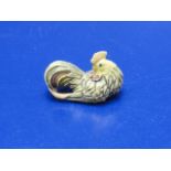 A well carved cockerel form netsuke