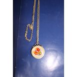 A collectable silver & enamel coin & chain