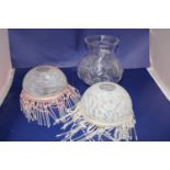 Two vintage glass lamp shades and a cut glass oil lamp shade.
